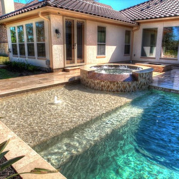 Rectangular pool with walkover water feature, fire pit, and landscape