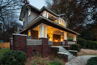 Design ideas for an arts and crafts two-storey brown exterior in Charlotte with wood siding.