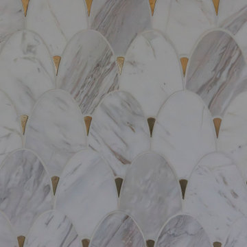 Gold accented wall tile by freestanding bathtub