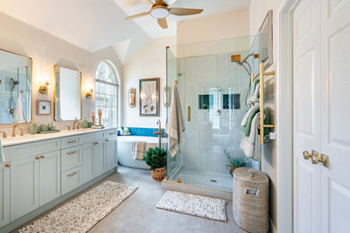 Mid-sized transitional master gray tile porcelain tile, double-sink and gray floor bathroom photo in Austin with quartz countertops, white countertops, a built-in vanity, shaker cabinets, turquoise cabinets, beige walls, an undermount sink and a hinged shower door