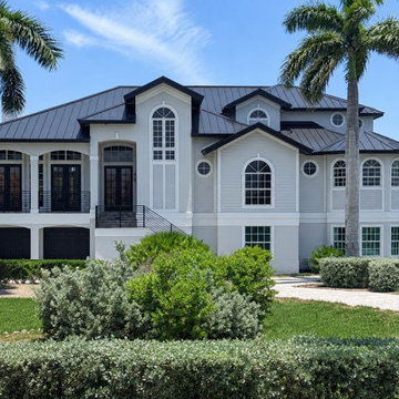 Modern Coastal Exterior Renovation with Warm Neutrals and Black Accents