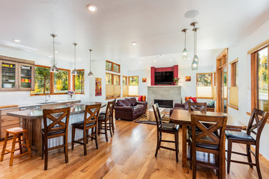 Inspiration for a mid-sized modern open concept light wood floor living room remodel in Denver with white walls, a standard fireplace, a tile fireplace and a wall-mounted tv
