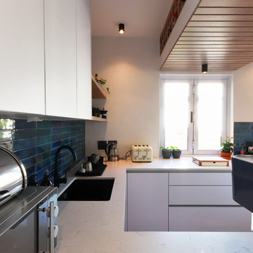 Contemporary Kitchen with Canopy and Bulkhead Wine Storage
