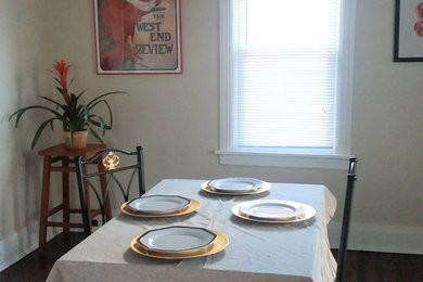 Inspiration for a craftsman dark wood floor dining room remodel in Other with beige walls