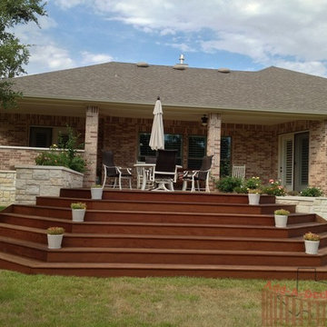 Ipe Hardwood Decking with Metal Framing, Limestone Flower Beds around Deck