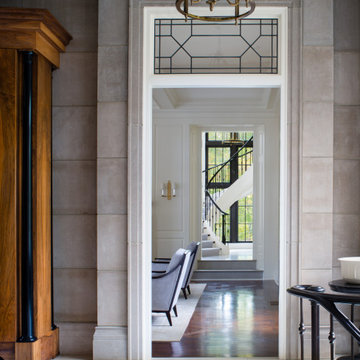 Limestone Entry Foyer with Transom and Floating Staircase View