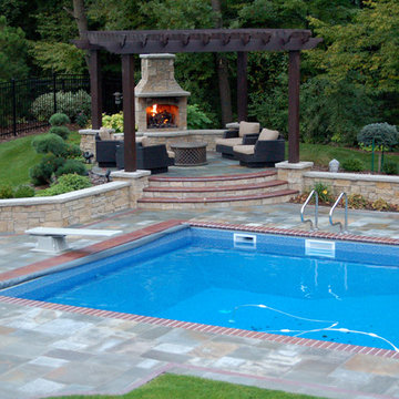 Bluestone pool decks, arbors, fireplaces, outdoor kitchen & pavilion