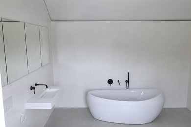 This is an example of a contemporary bathroom in Cambridgeshire.