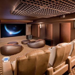 Photo of a medium sized modern enclosed home cinema in Newark with brown walls, carpet, a wall mounted tv and multi-coloured floors.