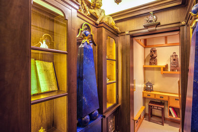 Example of a small classic dark wood floor hallway design in Chicago with brown walls