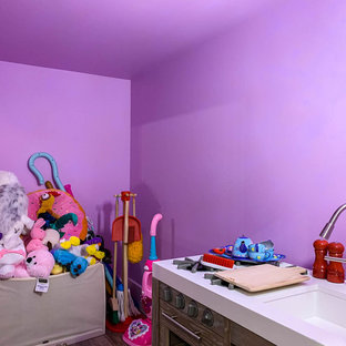 Photo of a small rural walk-out basement in Chicago with pink walls, vinyl flooring and brown floors.