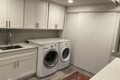 Example of a trendy laundry room design in Other