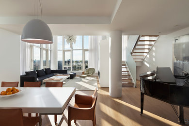 Living room - modern living room idea in New York with white walls