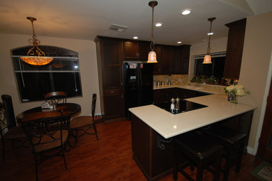 Example of a classic kitchen design in Other