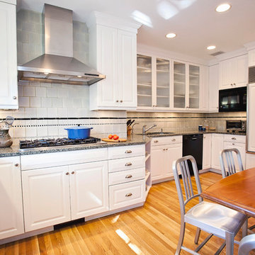 Glass Fronted Cabinetry Break up a Wall of Cabinets