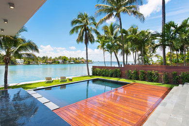 Inspiration for a large contemporary backyard rectangular pool remodel in Miami