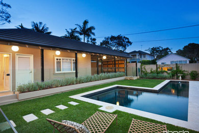 Inspiration for a large contemporary two-storey brick white house exterior in Sydney with a flat roof and a metal roof.