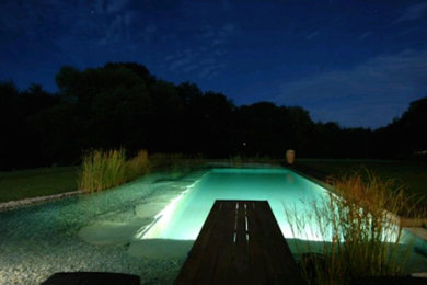 Inspiration for a backyard gravel and rectangular pool remodel in Toronto