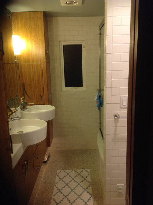 What art should I hang above toilet in Mid century modern bathroom?