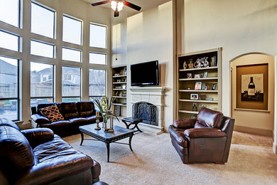Inspiration for a large timeless open concept carpeted and beige floor family room remodel in Houston with beige walls, a standard fireplace, a stone fireplace and no tv