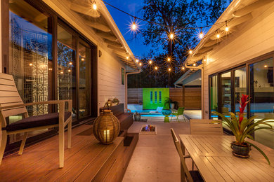 Small contemporary backyard patio in Dallas with a fire feature, tile and no cover.