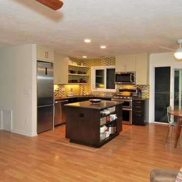 Two tone cabinets blend with made-to-order Yarrow Mural tile.