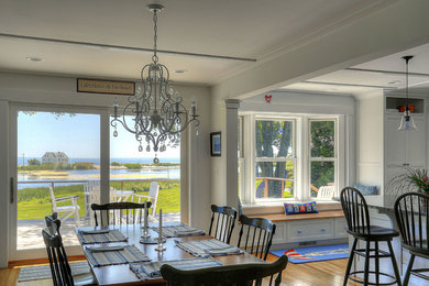 Beach style light wood floor dining room photo in Bridgeport with white walls