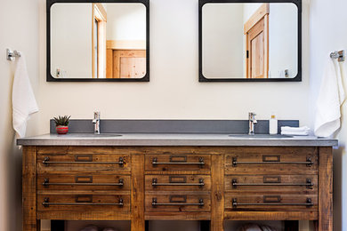 Example of a large mountain style master gray tile and slate tile slate floor and gray floor doorless shower design in Boston with shaker cabinets, light wood cabinets, white walls, an integrated sink, concrete countertops, a hinged shower door and gray countertops