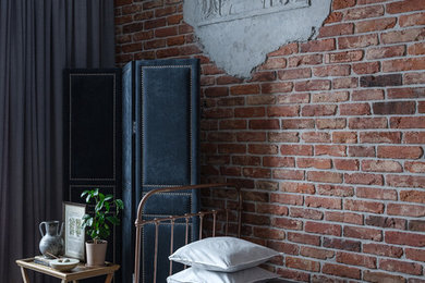 Photo of an industrial bedroom in Moscow with brown walls and brown floor.