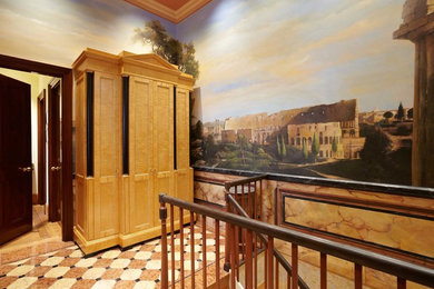 Large traditional hallway in London with multi-coloured walls and marble floors.
