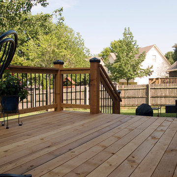 Stoerman - Cedar deck in Overland Park, Ks. Stamped concrete patio & deck light