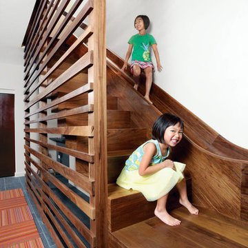 Custom walnut stairs and slide hybrid