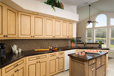 This is an example of a mid-sized transitional u-shaped kitchen pantry in Jacksonville with an undermount sink, recessed-panel cabinets, beige cabinets, granite benchtops, brown splashback, white appliances, ceramic floors, with island, beige floor, mosaic tile splashback, black benchtop and vaulted.