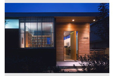 Pivot front door - modern pivot front door idea in Other with a brown front door