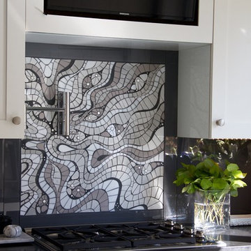 Impel | shimmering grayscale cut glass outlined in slate grout