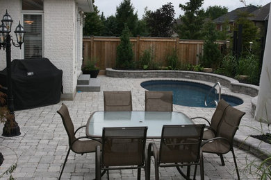 Pool house - mid-sized modern backyard natural pool house idea in Toronto