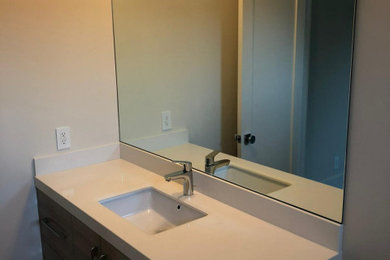 Example of a small minimalist 3/4 white tile and stone tile single-sink bathroom design in San Francisco with furniture-like cabinets, brown cabinets, granite countertops, white countertops and a floating vanity