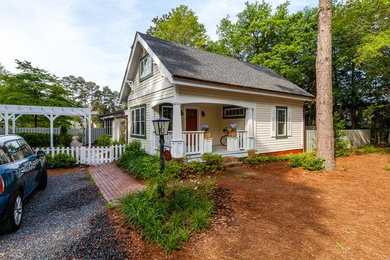 Small farmhouse yellow one-story wood exterior home idea in Raleigh