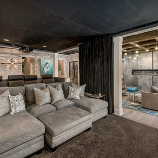 Large contemporary fully buried basement in Chicago with beige walls, medium hardwood flooring, a ribbon fireplace, brown floors and a metal fireplace surround.