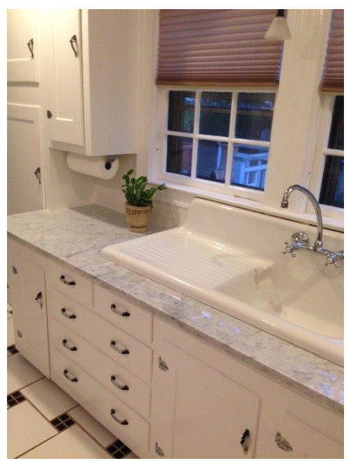 My new marble counters are scratching and getting water spot marks