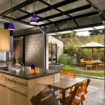 Kitchen with Private Courtyard outside Glass Garage Doors