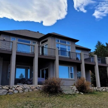 Huge Composite Deck with Aluminum Deck Railing and Stucco Columns