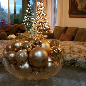 Bowl filled with gold ornaments and star