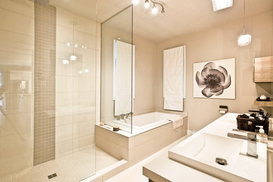 Bathroom - mid-sized traditional master beige tile and ceramic tile ceramic tile and beige floor bathroom idea in Other with flat-panel cabinets, brown cabinets, a one-piece toilet, beige walls, a drop-in sink, laminate countertops and beige countertops