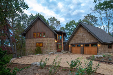 Example of a mountain style brown two-story mixed siding exterior home design in Other with a shingle roof