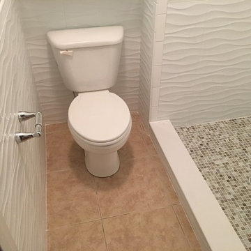 Fiberglass shower replacement with tile shower.
