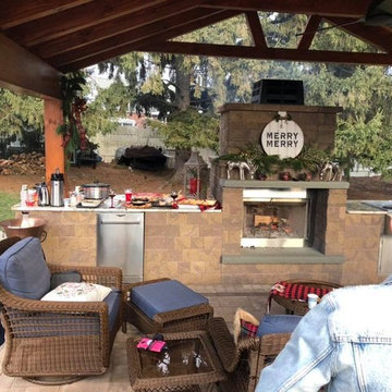 Outdoor fireplace and kitchen area