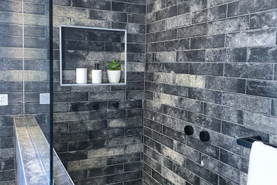 Inspiration for a mid-sized industrial kids bathroom in Other with flat-panel cabinets, white cabinets, a freestanding tub, an alcove shower, black and white tile, multi-coloured walls, ceramic floors, solid surface benchtops, multi-coloured floor, an open shower, white benchtops, a single vanity and a freestanding vanity.