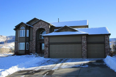 Large traditional brown two-story mixed siding exterior home idea in Denver with a shingle roof