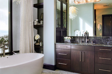 Inspiration for a mid-sized contemporary master porcelain tile and beige floor freestanding bathtub remodel in New York with flat-panel cabinets, dark wood cabinets, beige walls, an undermount sink, quartzite countertops and gray countertops